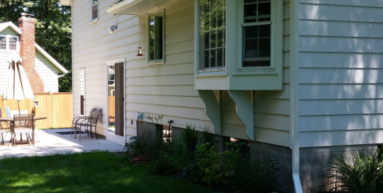 Downspout drop onto roof